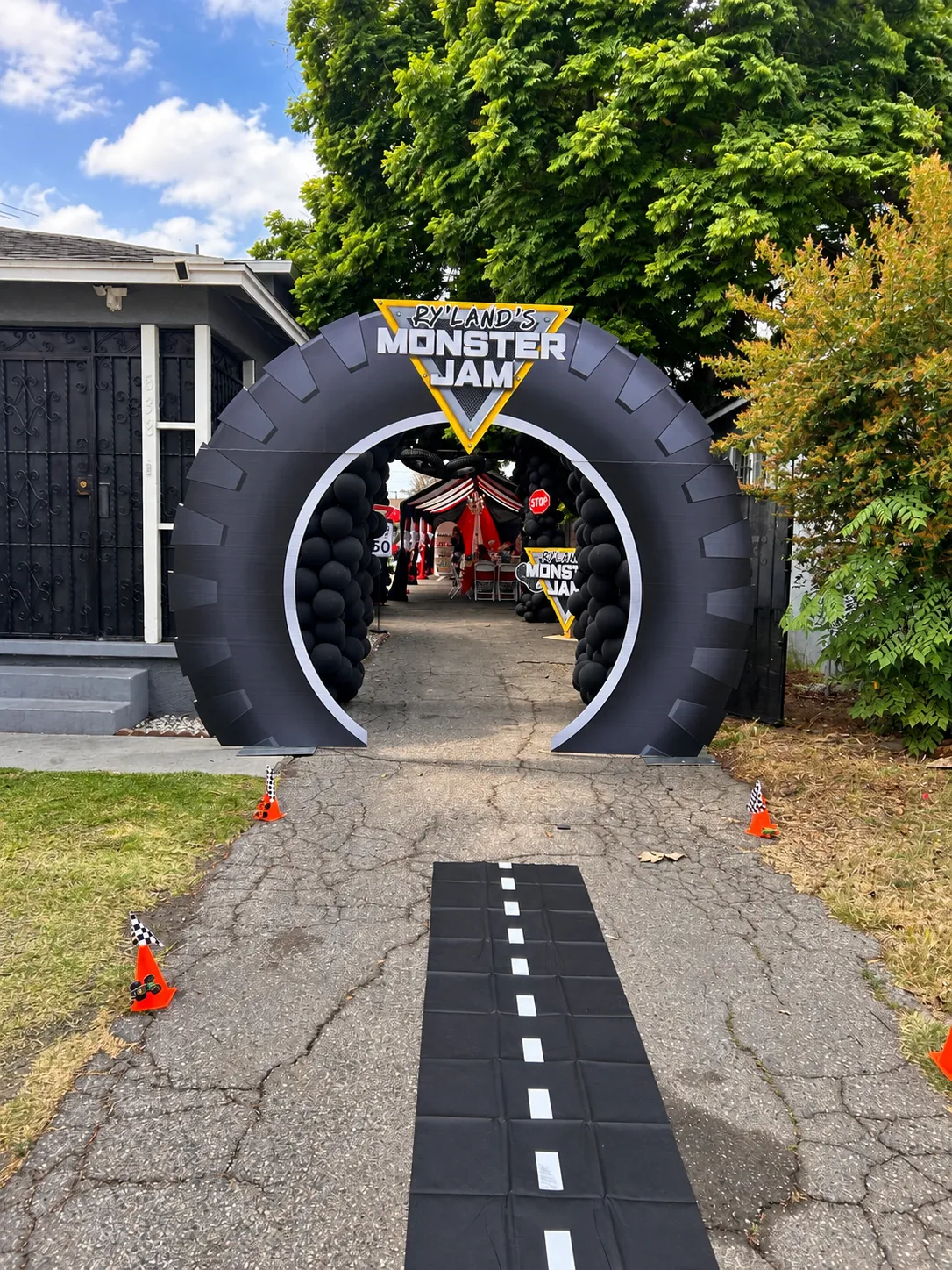 Giant tire entrance arch with road walkway